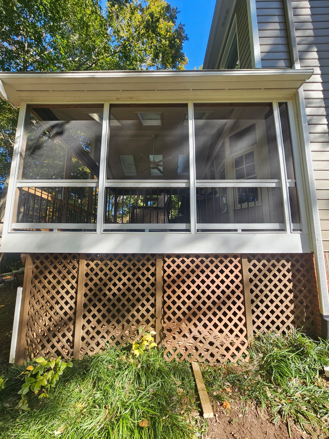 Completed ScreenEZE screened porch overlooking the water.